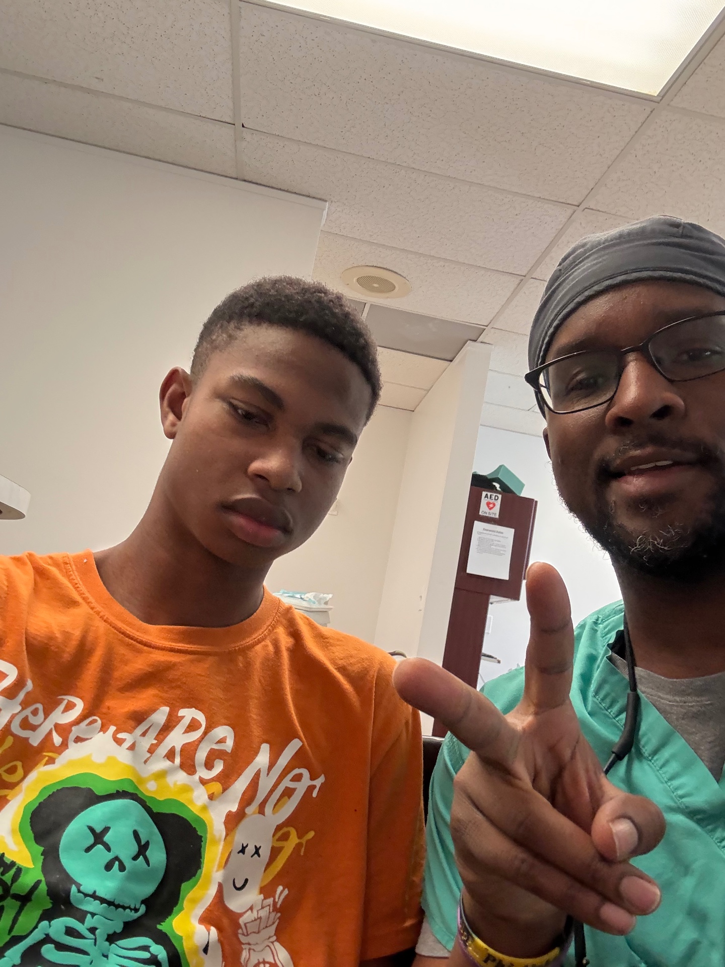 Patient and Dr. Baawo after treatment