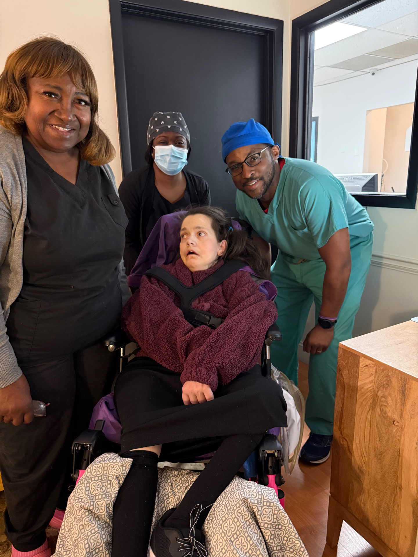Dental team with a wheelchair patient